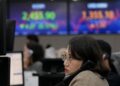 World Markets Edge Lower as China Reports Slower Growth in the Last Quarter