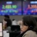 World Markets Edge Lower as China Reports Slower Growth in the Last Quarter