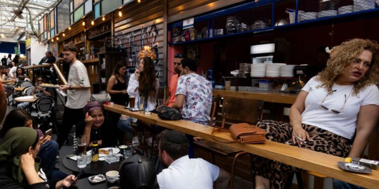 Israelis Go About Their Business as They Await Iranian Missiles